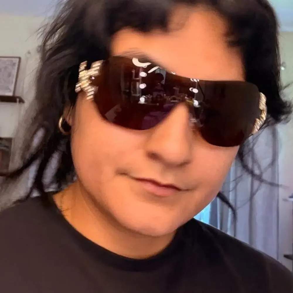Brown shield sunglasses featuring oversized rimless lenses rhinestone luxe y2k